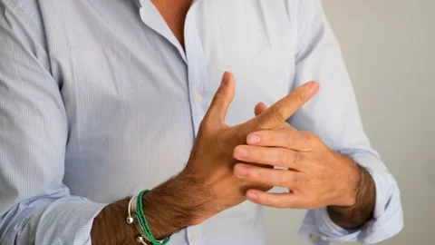 Close up of a man hands cracking the knuckles Stock Footage 277134997