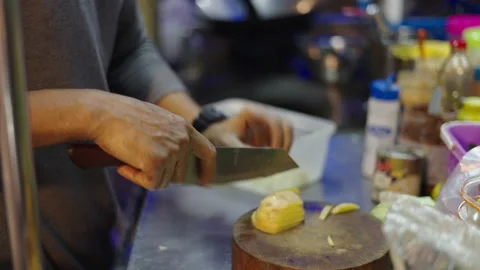 Close up of man hands cutting potato with a sharpen knife Stock Footage 234978583