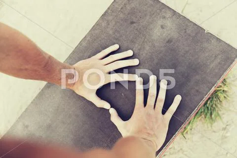 Close up of man hands exercising on bench outdoors Stock Photos