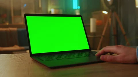 Close up man hands of freelancer use laptop with green screen. At home. Working Stock Footage 238746885