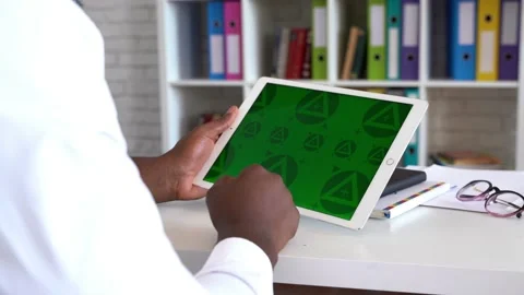 CLose up of man' hands with green screen tablet. Chroma key mock up Stock Footage 197442500