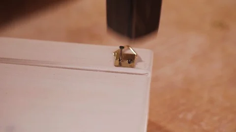 Close up. Man hands hammering a nail at the workshop. Handmade Stock Footage 110685166