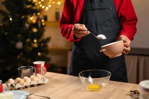 Close-up of man hands making dough for christmas gingerbread cookies, putti.. Stock Photos