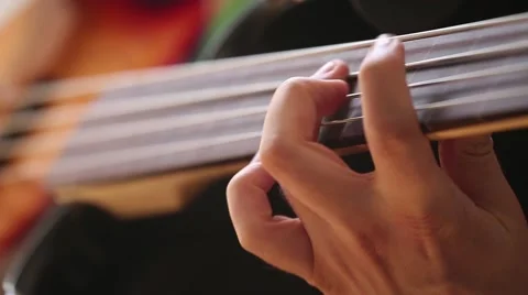 Close-up on Man hands playing on bass guitar. Stock-Footage 68048199