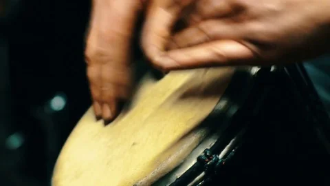 Close up of man hands playing on a drum. 4k shot Video stock 77486973