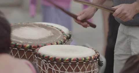 Close-up of Man hands playing drums on a street Stock Footage 150434803