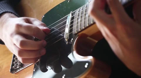 Close-up on Man hands playing on electric guitar. Vídeo Stock 68048164