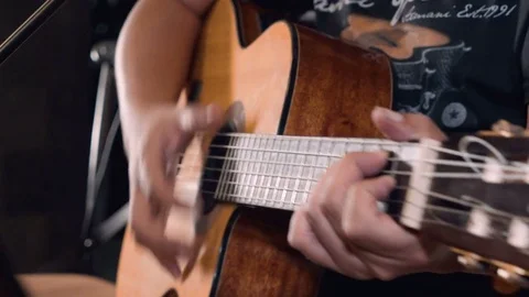 Close up of man hands playing guitar Stock Footage 78798652