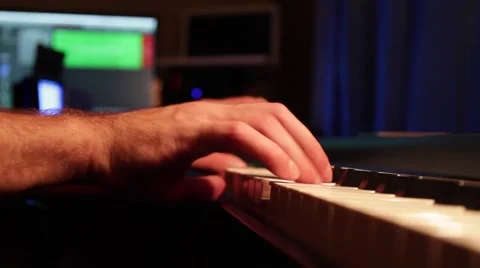 Close up of man hands playing on the piano and recording himself to the computer Stock-Footage 66471803