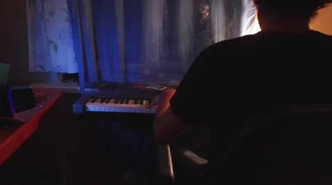 Close up of man hands playing piano in his room Stock Footage 66472037