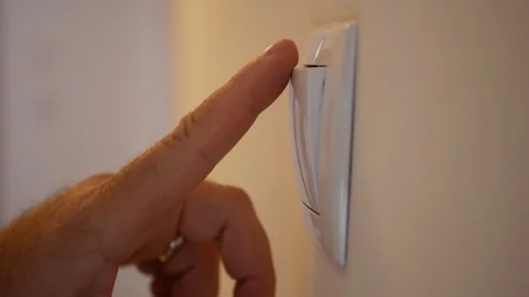 Close Up Man Hands Pushing Light Switch in On and Off Position Видео 97714891