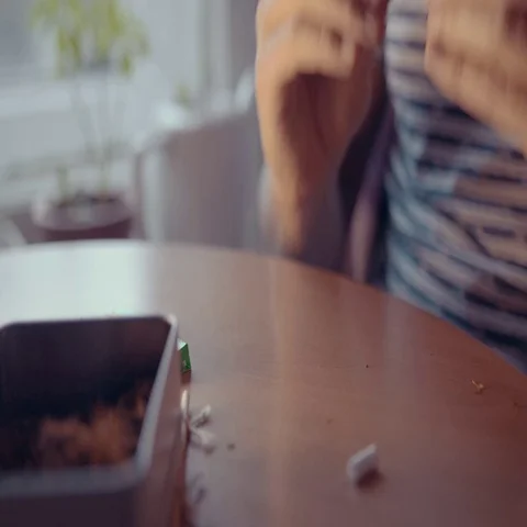 Close up of man hands rolling cigarettes Stock Footage 69297087