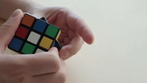 Close-up of a man hands solving a Magic Cube in Budapest Stock Footage 172150253