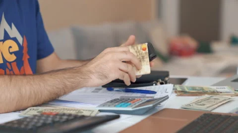 Close up Man hands takes his credit card out of his wallet and shops online. Stock Footage 160190041