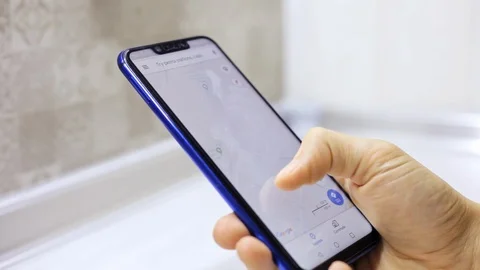 Close-up of man hands tapping maps on smartphone Stock Footage 99314578