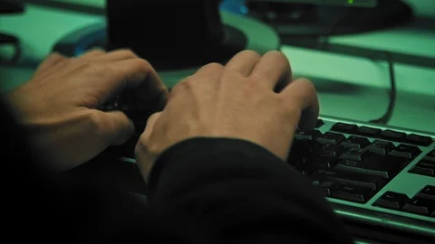 Close up of man hands typing on a computer keyboard, indoors. 4k (UHD) Video stock 114110079