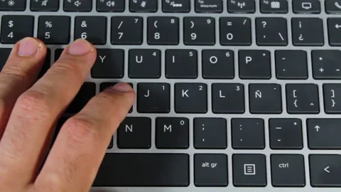 Close up of a man hands typing on a computer keyboard Video stock 153875542