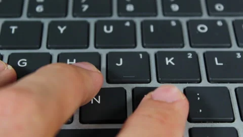 Close up of a man hands typing on a computer keyboard Video stock 153875561