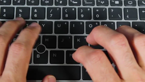 Close up of a man hands typing on a computer keyboard Video stock 153875597