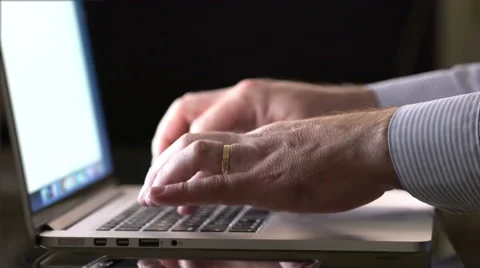 Close up of man hands typing on a laptop keyboard Stock Footage 69064754