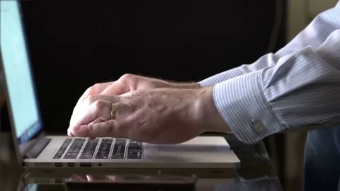 Close up of man hands typing on a laptop keyboard Stock Footage