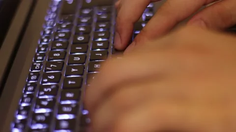 Close up of man hands typing on a laptop computer keyboard.Macro view of man Stock Footage 137423642