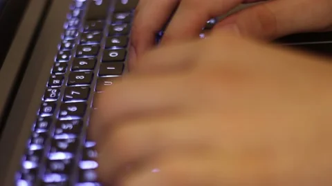Close up of man hands typing on a laptop computer keyboard.Macro view of man Stock Footage 137424291