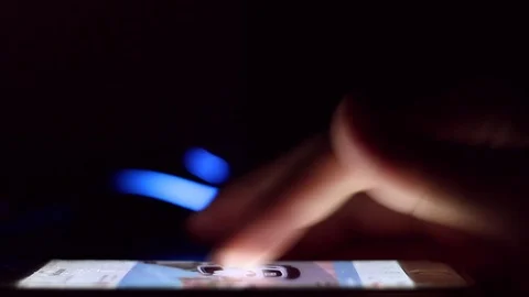 Close up of man hands typing scrolling pictures phone at night. Stock Footage 90800244