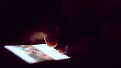 Close up of man hands typing scrolling pictures phone at night. Stock Footage 91083171