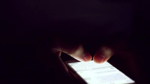 Close up of man hands typing scrolling pictures phone at night. Stock Footage 91083182