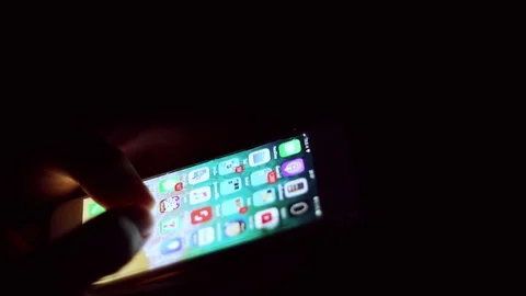 Close up of man hands typing scrolling pictures phone at night. Stock Footage 91083209