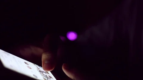 Close up of man hands typing scrolling pictures phone at night. Stock Footage 91384168