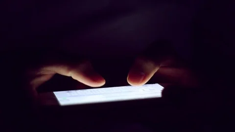 Close up of man hands typing scrolling pictures phone at night. Stock Footage 91384191
