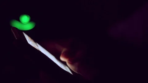 Close up of man hands typing scrolling pictures phone at night. Stock Footage 91384330
