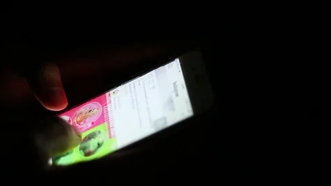 Close up of man hands typing scrolling pictures phone at night. Stock Footage 92193795