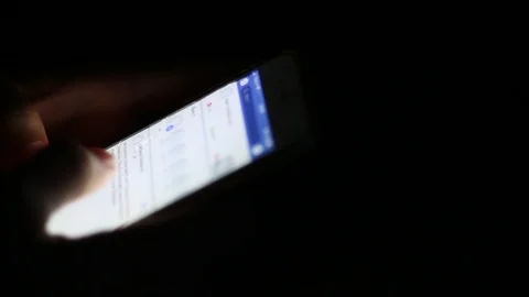 Close up of man hands typing scrolling pictures phone at night. Stock Footage 93948311