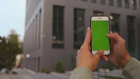 Close up man hands use smartphone on business office background green screen Stock Footage 116745651