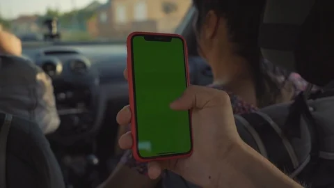 Close up man hands use smartphone with vertical green screen in car background Stock Footage 116997583