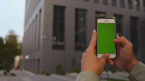 Close up man hands use smartphone on business office background green screen Stock Footage 117290688