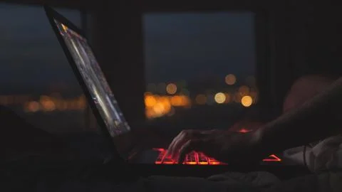 Close up of man hands using computer laptop at home interior modern office Stock Photos