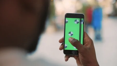 Close up man hands using phone with vertical green screen in mall hold finger Stock-Footage 85624339