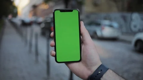 Close up man hands using phone with vertical green screen smart mobile Stock Footage 111593876
