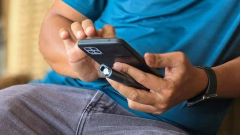 Close up of man hands using smartphone Stock Photos