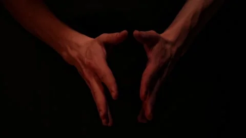 Close up man hands waiting on dark background.  Stock Footage 142138989