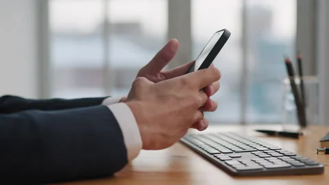 Close-up Man Hands Work on Mobile Phone in Office Room at Side View Stock Footage 169495659