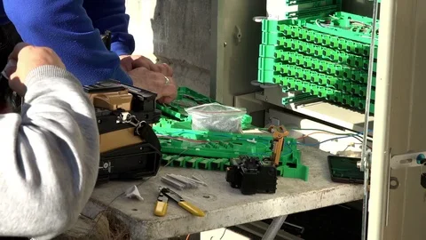 Close-up on the Man hands of the working with Optical fibre communication panel Stock Footage 83546035