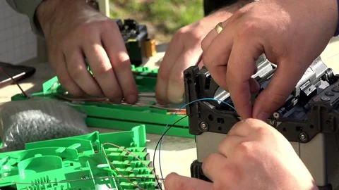 Close-up on the Man hands of the working with Optical fibre communication panel Stock Footage 83546054