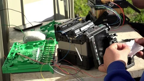 Close-up on the Man hands of the working with Optical fibre communication panel Stock Footage 83546261