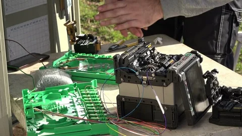 Close-up on the Man hands of the working with Optical fibre communication panel Stock Footage 83546346