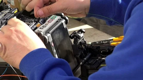 Close-up on the Man hands of the working with Optical fibre communication panel Stock Footage 83546395